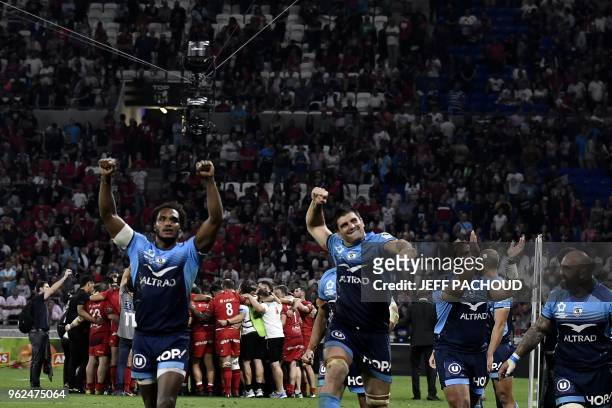 Montpellier's players celebrate their victory at the end of the French Top 14 union semi-final rugby match between Montpellier and Lyon on May 25,...