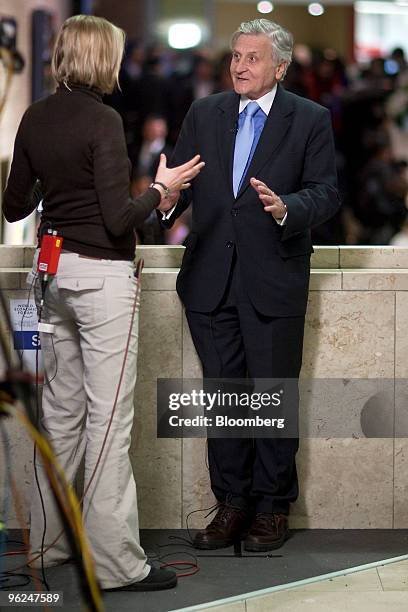 Jean-Claude Trichet, president of the European Central Bank , right, speaks during a television interview on day two of the 2010 World Economic Forum...