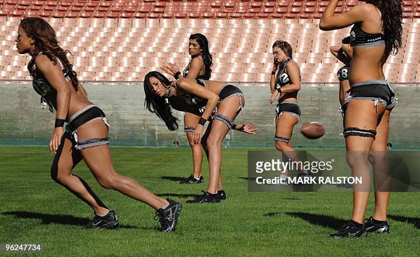 Jessica Renee trains with her Lingerie Football League team called the Los Angeles Temptation, at the historic Los Angeles Memorial Coliseum on...