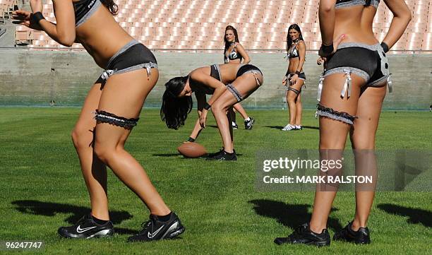 Jessica Renee trains with her Lingerie Football League team called the Los Angeles Temptation, at the historic Los Angeles Memorial Coliseum on...