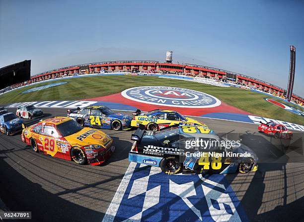 Pepsi 500: Juan Pablo Montoya , Mark Martin and Jimmie Johnson during restart at Auto Club Speedway. Fontana, CA CREDIT: Nigel Kinrade