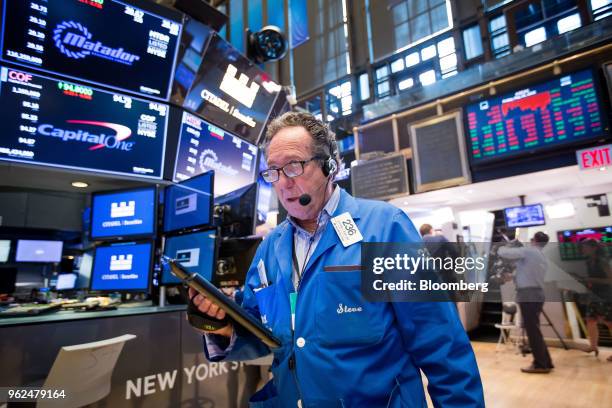 Trader works on the floor of the New York Stock Exchange in New York, U.S., on Friday, May 25, 2018. U.S. Stocks bounced between gains and losses as...