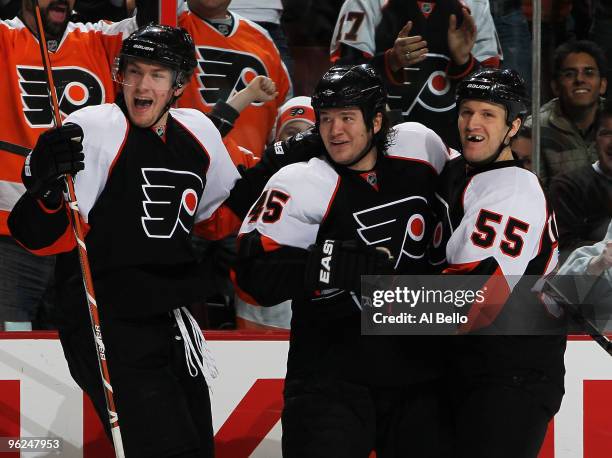 Arron Asham of The Philadelphia Flyers celebrates his goal with Claude Giroux and Ole-Kristian Tollefsen against the Atlanta Thrashers during their...