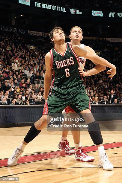 Andrew Bogut of the Milwaukee Bucks boxes out Rasho Nesterovic of the Toronto Raptors during the game on January 22, 2010 at Air Canada Centre in...