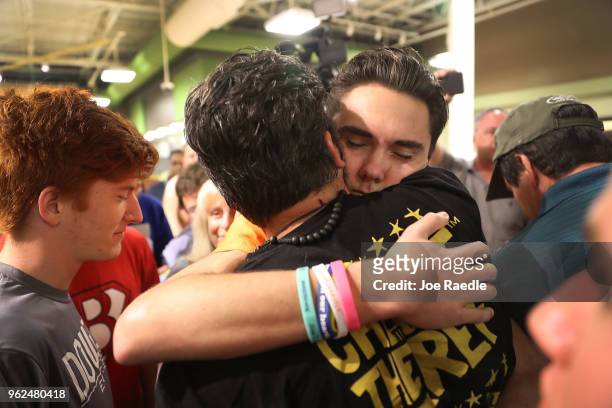 David Hogg hugs Manuel Oliver, whose son Joaquin Oliver, was killed in the Marjory Stoneman Douglas High School mass shooting as they particpate in a...