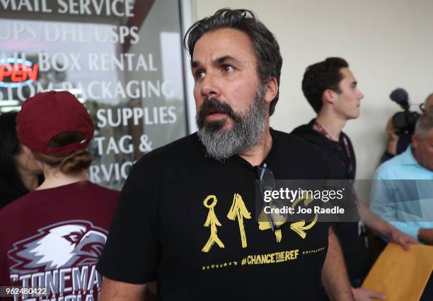 Manuel Oliver whose son Joaquin Oliver was killed in the Marjory Stoneman Douglas High School mass shooting particpates in a "die'-in" protest in a...