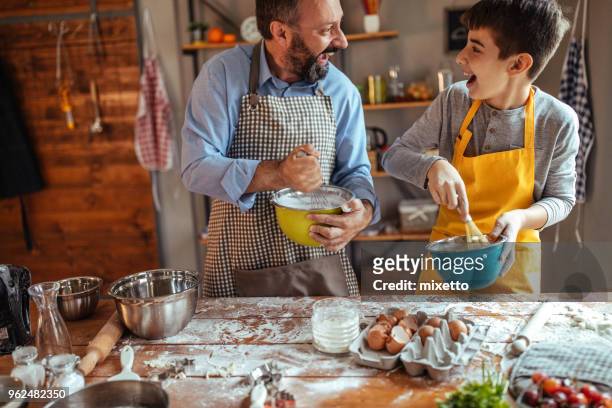 boys having fun in the kitchen - baking competition stock pictures, royalty-free photos & images