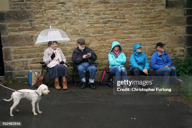Brass band enthusiasts wait to hear bands play in the Whit Friday brass band competition, in the village of Dobcross, on May 25, 2018 in Oldham,...