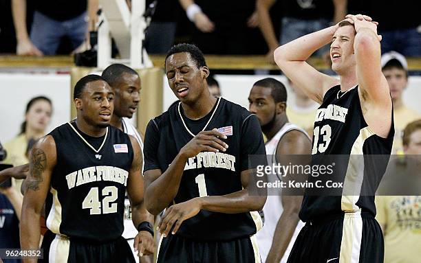 Al-Farouq Aminu and Chas McFarland of the Wake Forest Demon Deacons react after a turnover during the game against the Georgia Tech Yellow Jackets at...