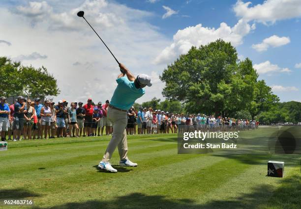 Fans watch Kevin Kisner hitting a tee shot on the third hole during the second round of the Fort Worth Invitational at Colonial Country Club on May...