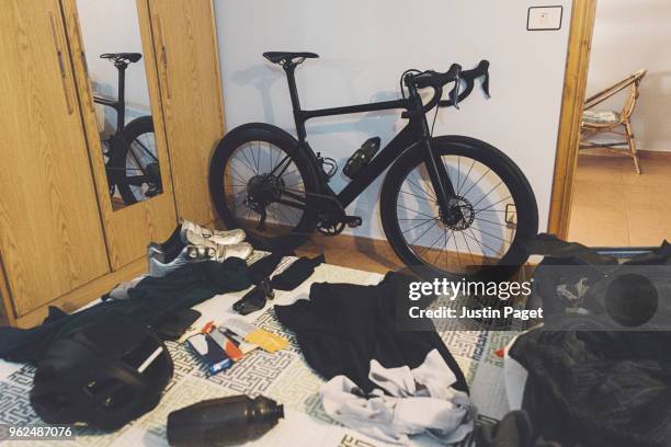 race bicycle and cycling kit in hotel room - cycling shoe stock pictures, royalty-free photos & images