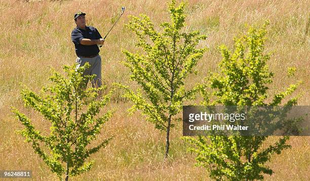 Craig Parry of Australia finds himself in the rough on the 13th hole during day two of the New Zealand Open at The Hills Golf Club on January 29,...