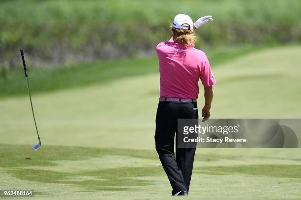 Miguel Angel Jimenez of Spain throws a club on the 18th hole during the second round of the Senior PGA Championship presented by KitchenAid at the...