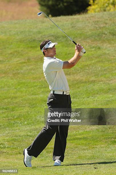Brigman of the USA plays an approach shot on the 13th hole during day two of the New Zealand Open at The Hills Golf Club on January 29, 2010 in...