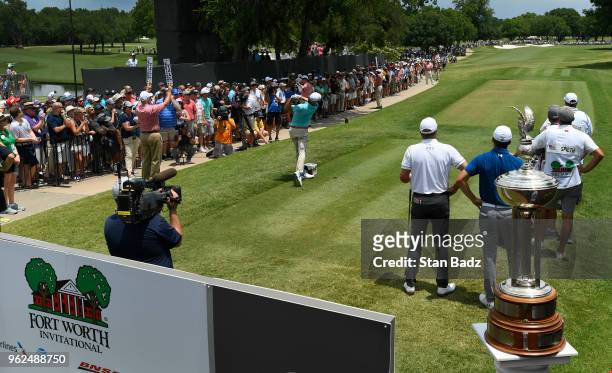 Fans watch Kevin Kisner hitting a tee shot on the first hole during the second round of the Fort Worth Invitational at Colonial Country Club on May...