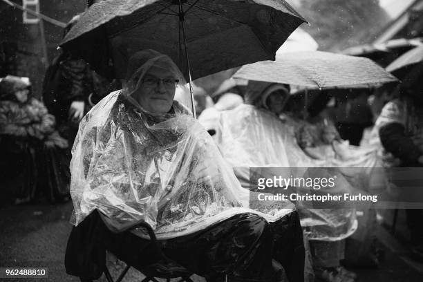 Brass Band enthusiasts brave the rain as they listen to bands play in the village of Delph during the Whit Friday brass band competition on May 25,...