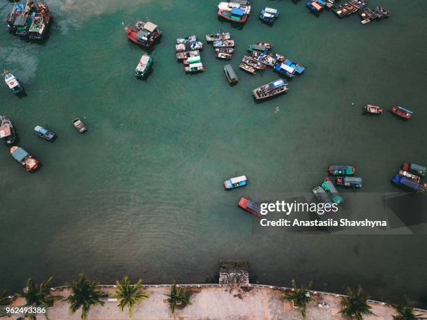 aerial view of colorful boats and road on cat ba island in vietnam - quang ninh stock pictures, royalty-free photos & images