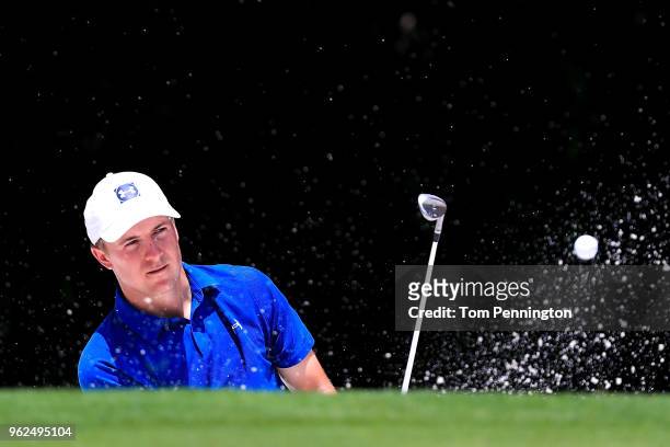Jordan Spieth plays a shot from a bunker on the fifth hole during round two of the Fort Worth Invitational at Colonial Country Club on May 25, 2018...