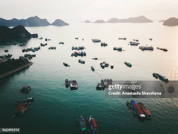 aerial view of sunset above fishing boats and small islands near cat ba in vietnam - quang ninh stock pictures, royalty-free photos & images