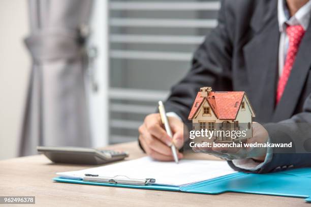 close up business man reaching out sheet with contract agreement proposing to sign.full and accurate details, individual who owns the business sign personally,director of the company, solicitor. - full responsibility stock pictures, royalty-free photos & images