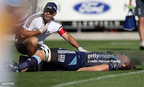 Ali Williams of the Blues lies down injured during the Super 14 trial match between the Blues and the Chiefs at North Harbour Stadium on January 29,...