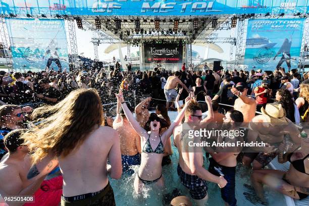 Fans watch Korpiklaani on the pool deck stage onboard the cruise liner 'Independence of the Seas' during the '70000 Tons of Metal' Heavy Metal Cruise...