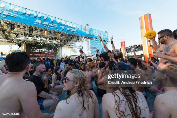 Fans watch Korpiklaani perform on the pool deck stage onboard the cruise liner 'Independence of the Seas' during the '70000 Tons of Metal' Heavy...