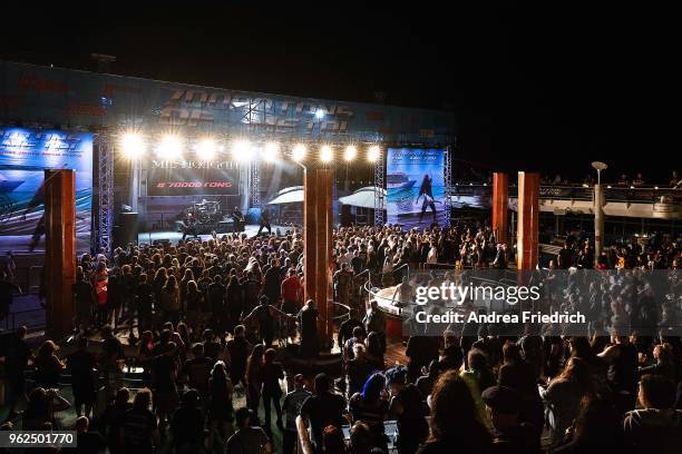 Fans watch Meshuggah perform on the pool deck stage onboard the cruise liner 'Independence of the Seas' during the '70000 Tons of Metal' Heavy Metal...