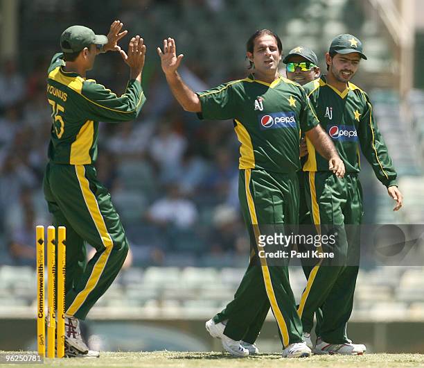 Naved-ul-Hasen of Pakistan celebrates the wicket of Brad Haddin of Australia during the fourth One Day International match between Australia and...