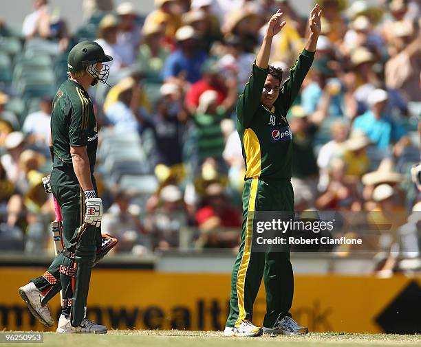 Saeed Ajmal of Pakistan takes the wicket of Cameron White of Australia during the fourth One Day International match between Australia and Pakistan...