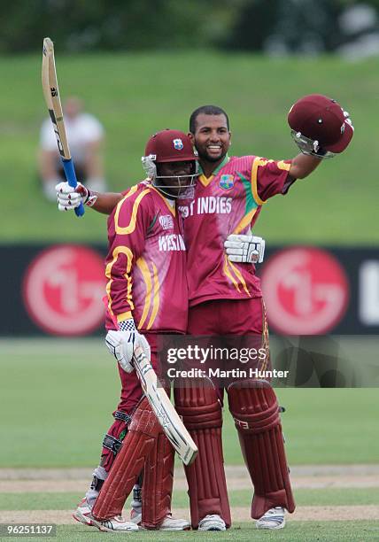 Yannic Cariah of the West Indies is hugged by team mate Jermaine Blackwood during the ICC U19 Cricket World Cup Super League quarter final between...