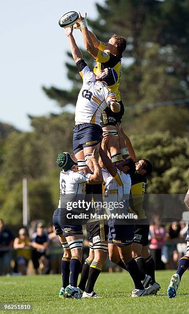James Broadhurst of the Hurricanes jumps for the ball with Ben Hand of the Brumbies during a Super 14 Trial match between the Hurricanes and the...