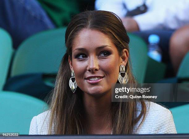Model and TV personality Erin McNaught watches the semifinal match between Roger Federer of Switzerland and Jo-Wilfried Tsonga of France during day...