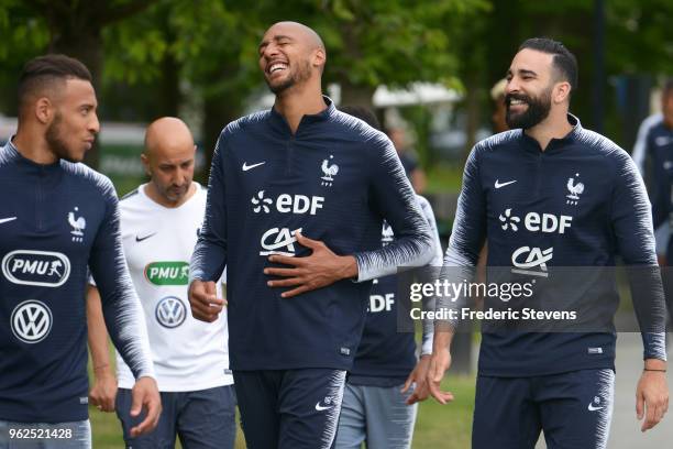 France's midfielder Steven Nzonzi and Adil Rami arrive a training session at the French national football team centre in Clairefontaine-en-Yvelines...