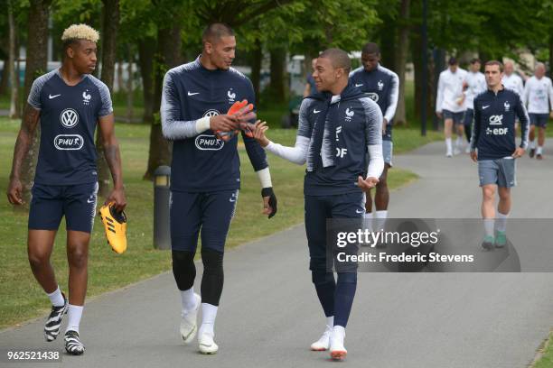 France's goalkeeper Alphonse Areola and Kylian Mbappe arrive to a training session at the French national football team centre in...