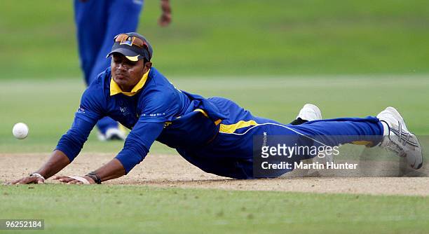 Dhanihka Gunathilleke of Sri Lanka miss fields the ball during the ICC U19 Cricket World Cup Super League quarter final between West Indies and Sri...