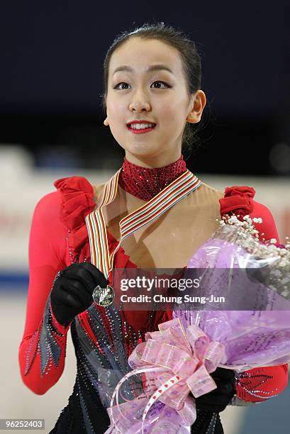 Winner Mao Asada of Japan stands after competing in the Ladies free program during the ISU Four Continents Championship at Hwasan Ice Arena on...