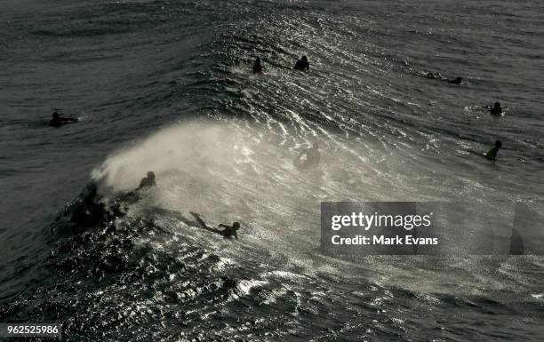 Surfers take advantage of a large swell at Bronte Beach on May 26, 2018 in Sydney, Australia.