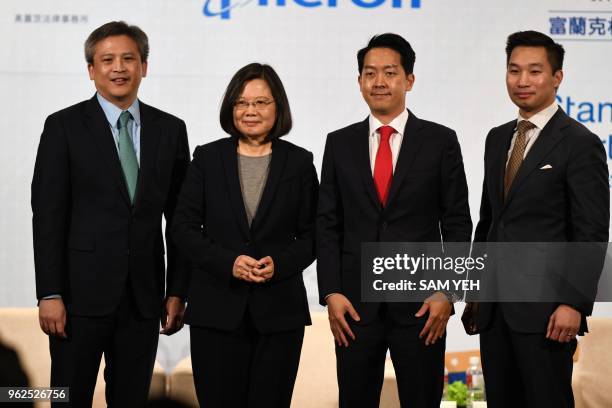 In this photo taken on March 21 Taiwan President Tsai Ing-wen poses with American Institute in Taiwan director Kin Moy , AmCham Taipei chairman...