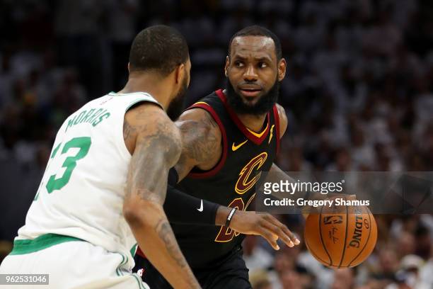 LeBron James of the Cleveland Cavaliers handles the ball against Marcus Morris of the Boston Celtics in the second quarter during Game Six of the...