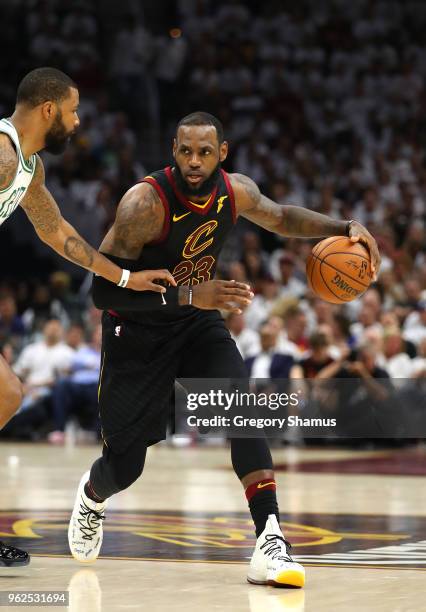 LeBron James of the Cleveland Cavaliers handles the ball in the second quarter against Marcus Morris of the Boston Celtics during Game Six of the...