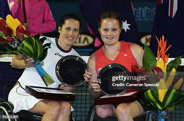 Florence Gravellier of France and Aniek van Koot of the Netherlands pose with their trophies after winning the Women's Wheelchair Doubles final match...