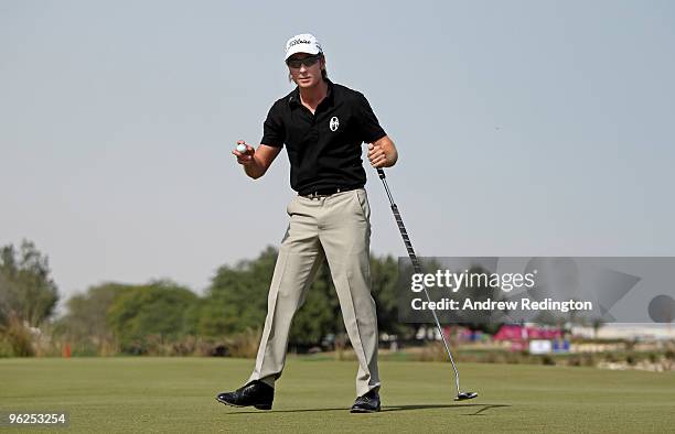 Brett Rumford of Australia acknowledges the crowd on the ninth hole during the second round of the Commercialbank Qatar Masters at Doha Golf Club on...