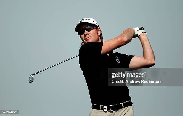 Brett Rumford of Australia hits his second shot on the ninth hole during the second round of the Commercialbank Qatar Masters at Doha Golf Club on...