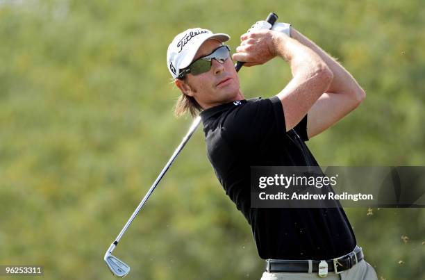 Brett Rumford of Australia hits his tee-shot on the eighth hole during the second round of the Commercialbank Qatar Masters at Doha Golf Club on...