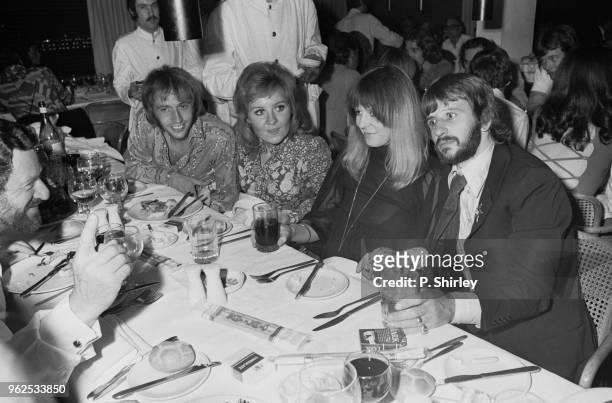 English drummer Ringo Starr of The Beatles pictured on right with his wife Maureen Starkey , Scottish singer Lulu and her husband Maurice Gibb of the...