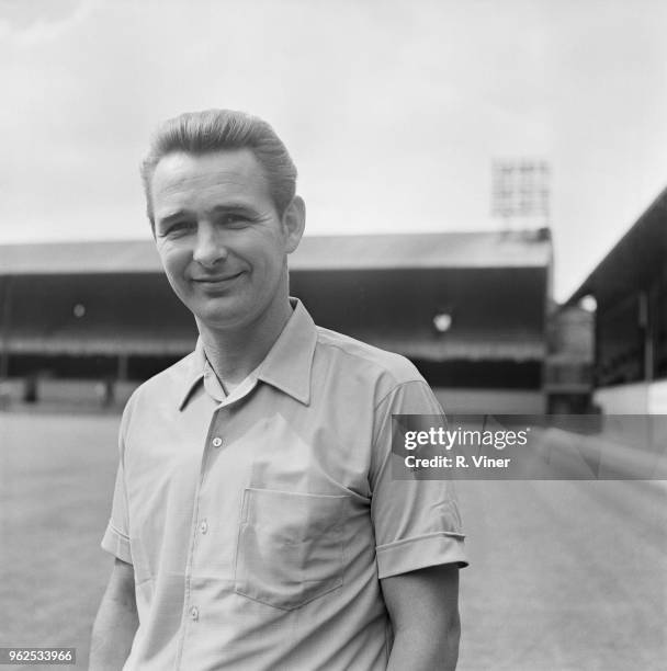 English former footballer and manager of Derby County Football Club, Brian Clough posed on the pitch at Derby County's Baseball Ground stadium in...