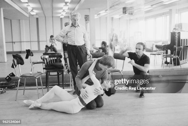 English ballerina Margot Fonteyn and Russian born ballet dancer Rudolf Nureyev rehearse for the filming of Nureyev's life story in front of Sir...