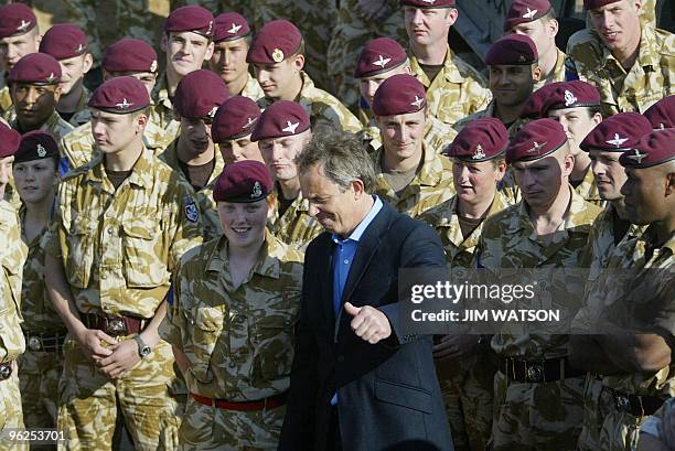 British Prime Minister Tony Blair gives the thumbs up as he greets female and male British troops at a British Military Installation at Basra...