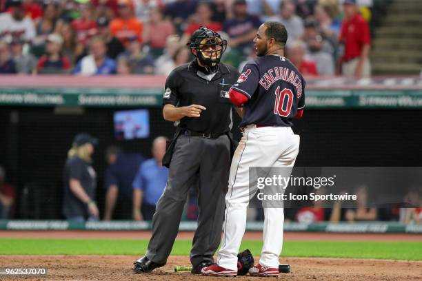 Cleveland Indians designated hitter Edwin Encarnacion talks to home plate umpire James Hoye after striking out during the seventh inning of the Major...